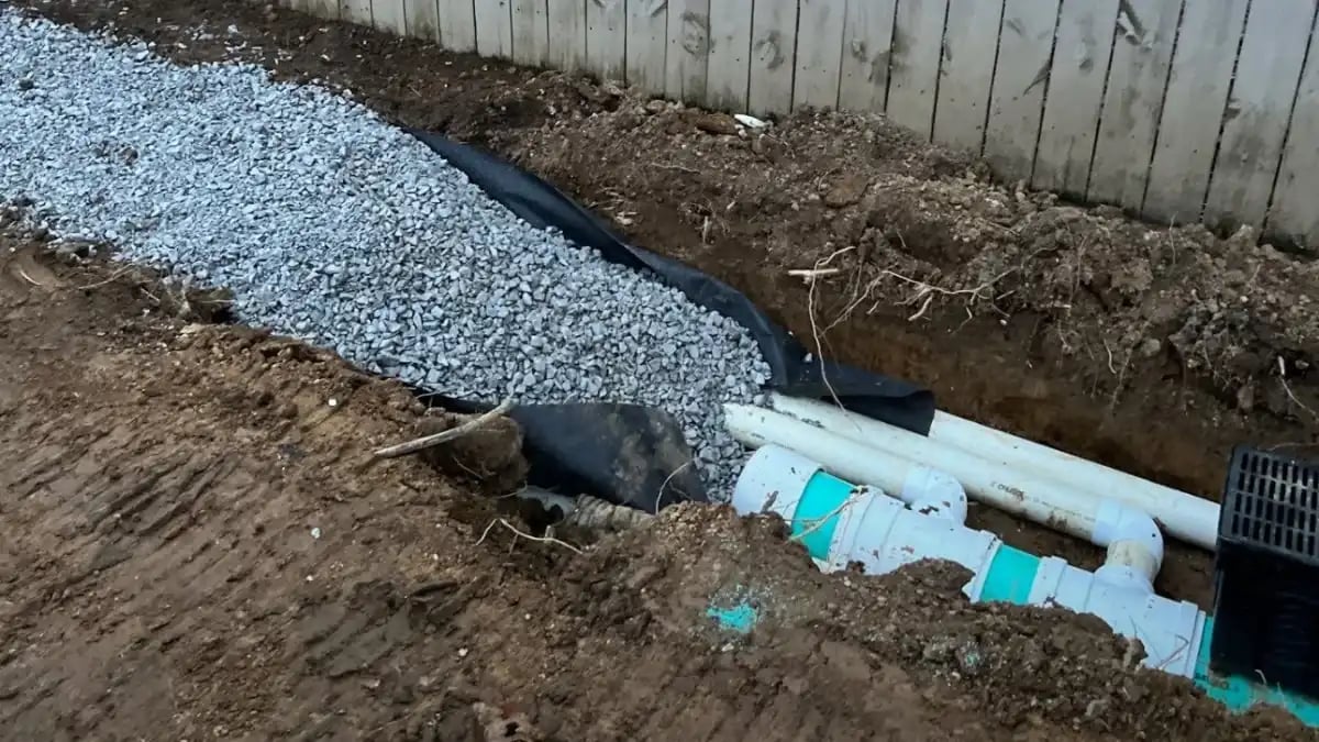 Drainage ditch in Harvest Alabama illustrating stormwater overflow risk affecting nearby businesses.