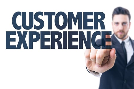 Business man pointing the text Customer Experience