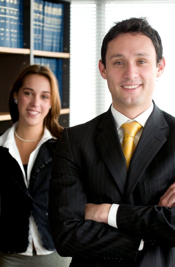 Business partners smiling in an office - man and woman