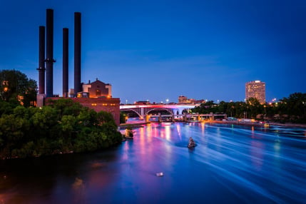 View of the Mississippi River from the Stone Arch Bridge at night in Minneapolis, Minnesota.