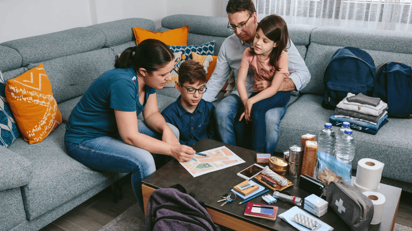 a family of four preparing for hurricane