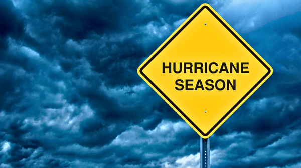 overcast clouds behind a sign of Hurricane Season