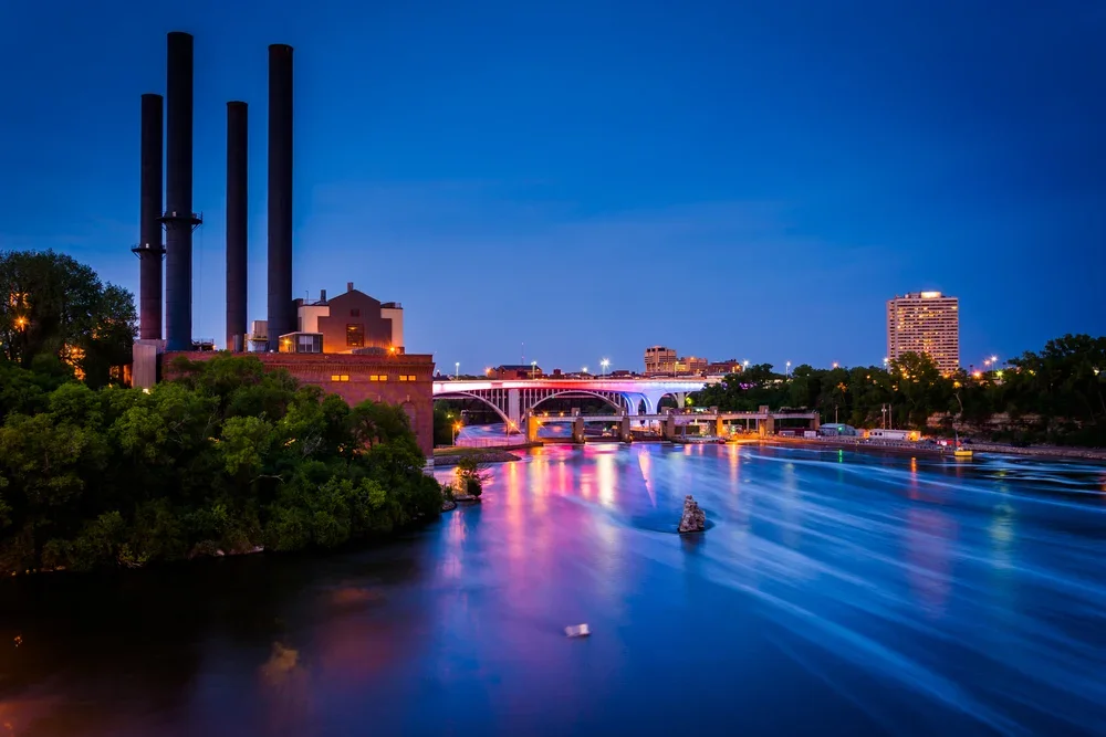 View of the Mississippi River from the Stone Arch Bridge at night in Minneapolis, Minnesota